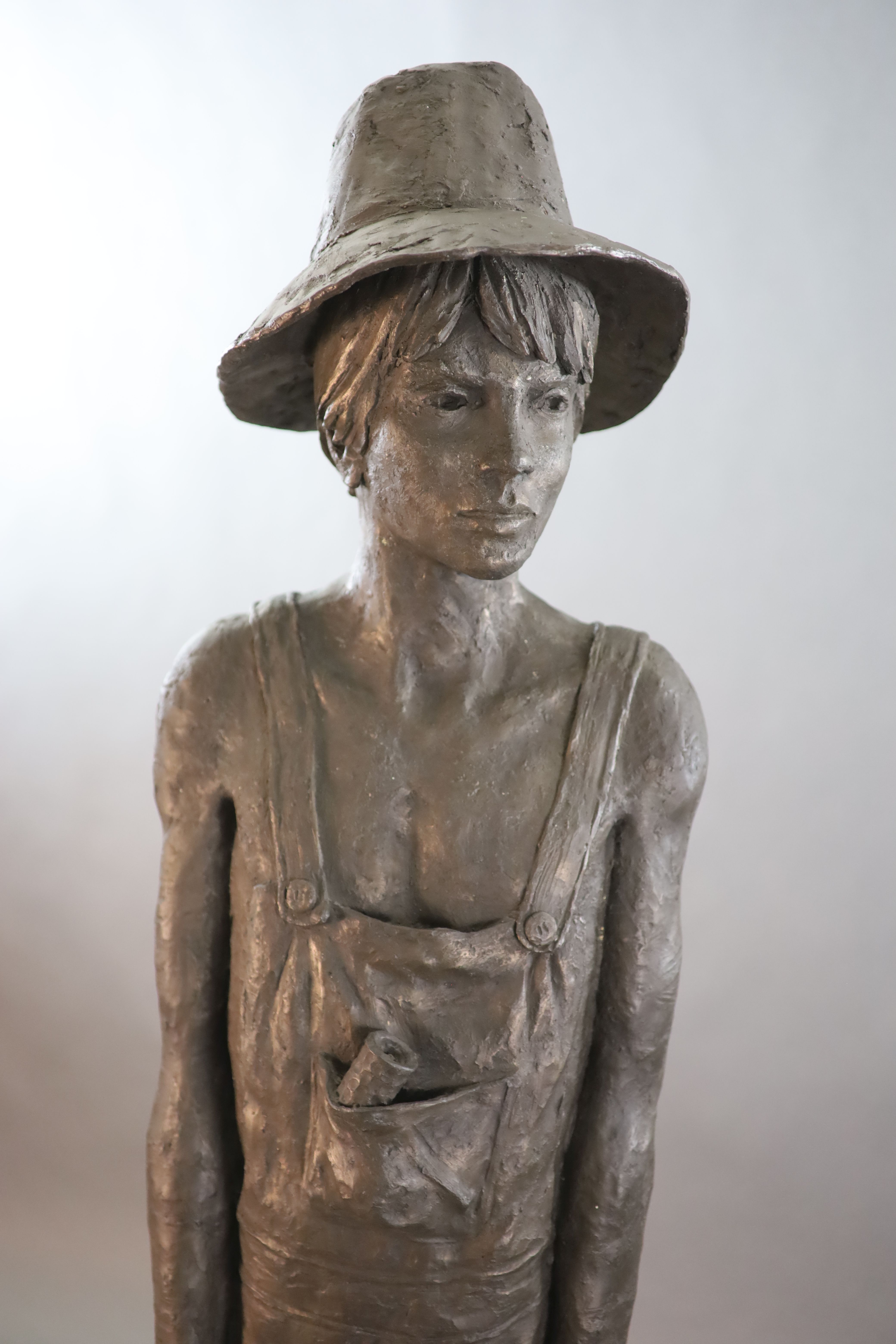 A Neil Godfrey bronzed composition life size figure of Tom Sawyer, height 5ft 2in.